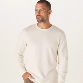 A front view of a white Vintage Thermal Crew sweater from The Normal Brand.