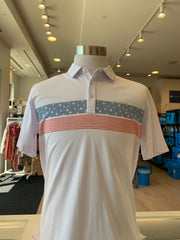 The Merica Polo in the color white from TravisMathew. Featuring stars and stripes across the chest.