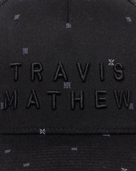 TravisMathew Shipwreck Beach Snapback Hat in the color black.