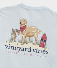 A good golden retriever acting as a lifeguard, on the back of a blue Vineyard Vines t-shirt.