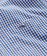Vineyard Vines Men's Stretch Poplin Gingham Button Down Shirt, in blue. Close up of the Vineyard Vines whale logo.