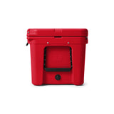 YETI Tundra 65 Hard Cooler in Rescue Red, full side view with side handle and water drain.