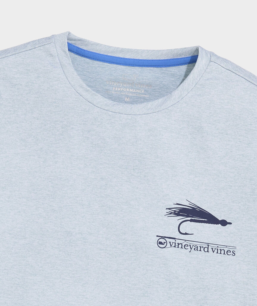 Men's long sleeve t-shirt in the color blue. Showing a fly fishing illustration and the Vineyard Vines logo. 