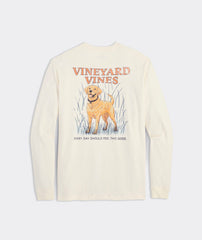 Long sleeve t-shirt with the graphic of a golden retriever dog on the back. Above the dogs is, "Vineyard Vines." Below the dog is the phrase, "EVERY DAY SHOULD FEEL THIS GOOD." The dog is standing in high grass, and the t-shirt is the color marshmallow.