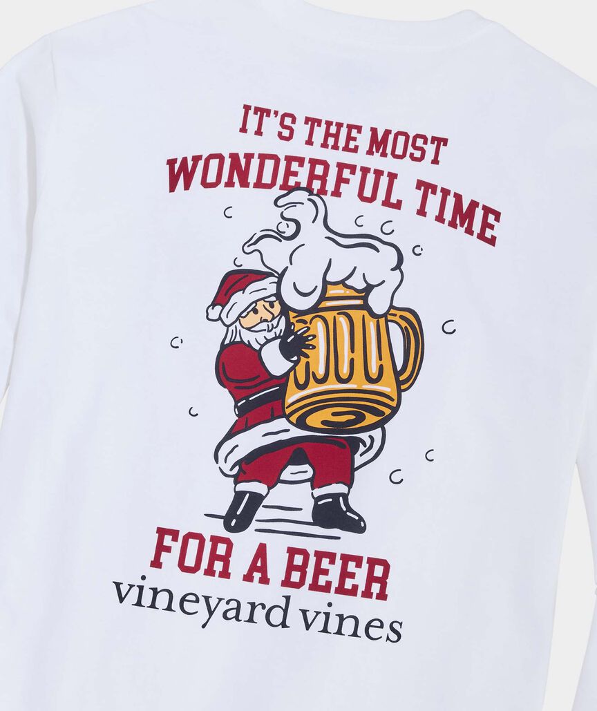 White long sleeve t-shirt with Santa Clause holding a mug of beer. The words "It's the most wonderful time for a beer." and the Vineyard Vines logo are shown.