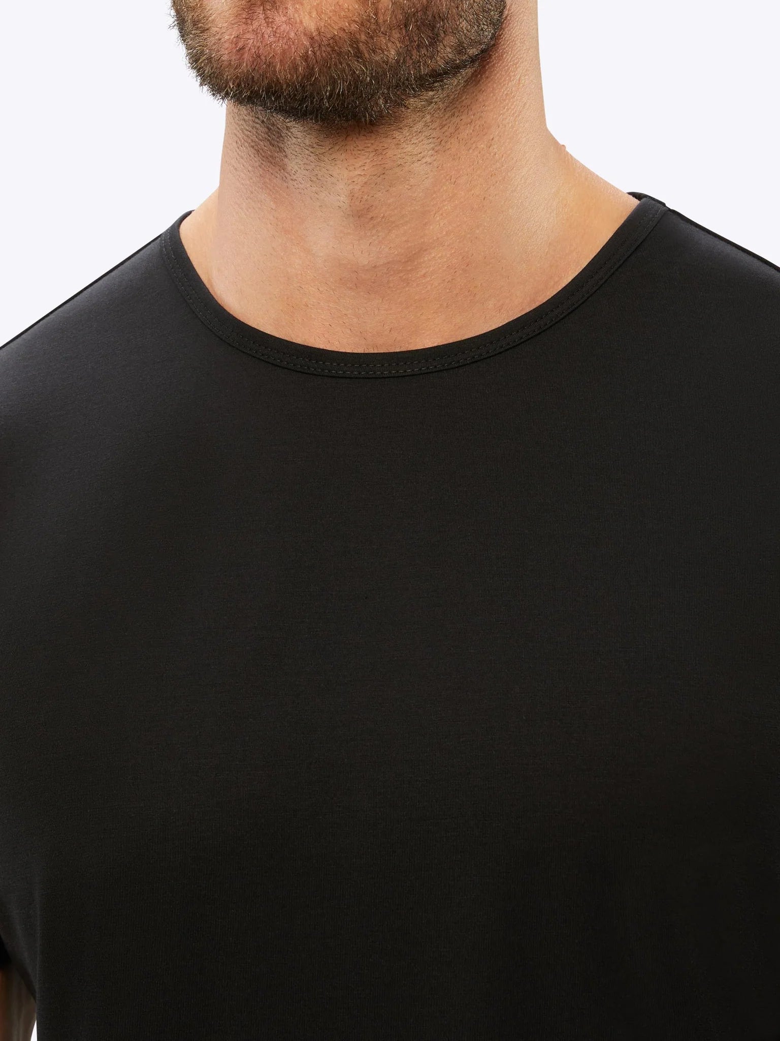 CUTS Clothing Men's AO Curve Hem T-shirt in color black.