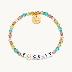 Multi color bead bracelet from Little Words Project that reads, "Fuck It" with a smily face replacing the letter, "U."