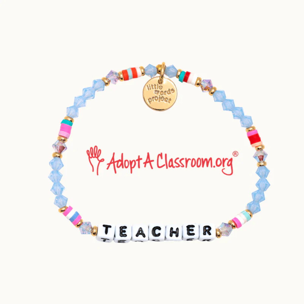 A blue bead bracelet made by Little Words Project that reads, TEACHER.