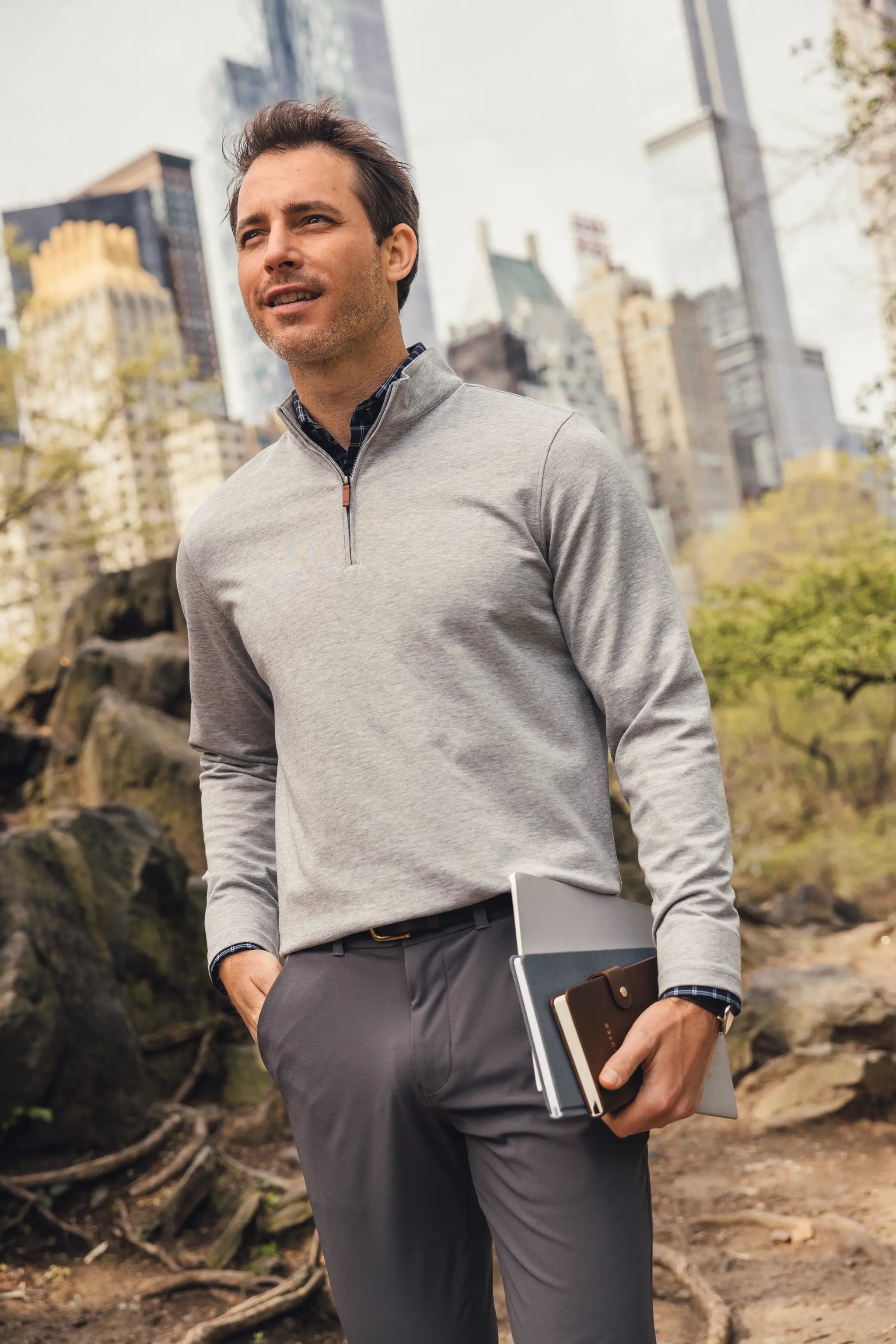 Grey men's golf quarter-zip sweater from the brand Mizzen+Main.