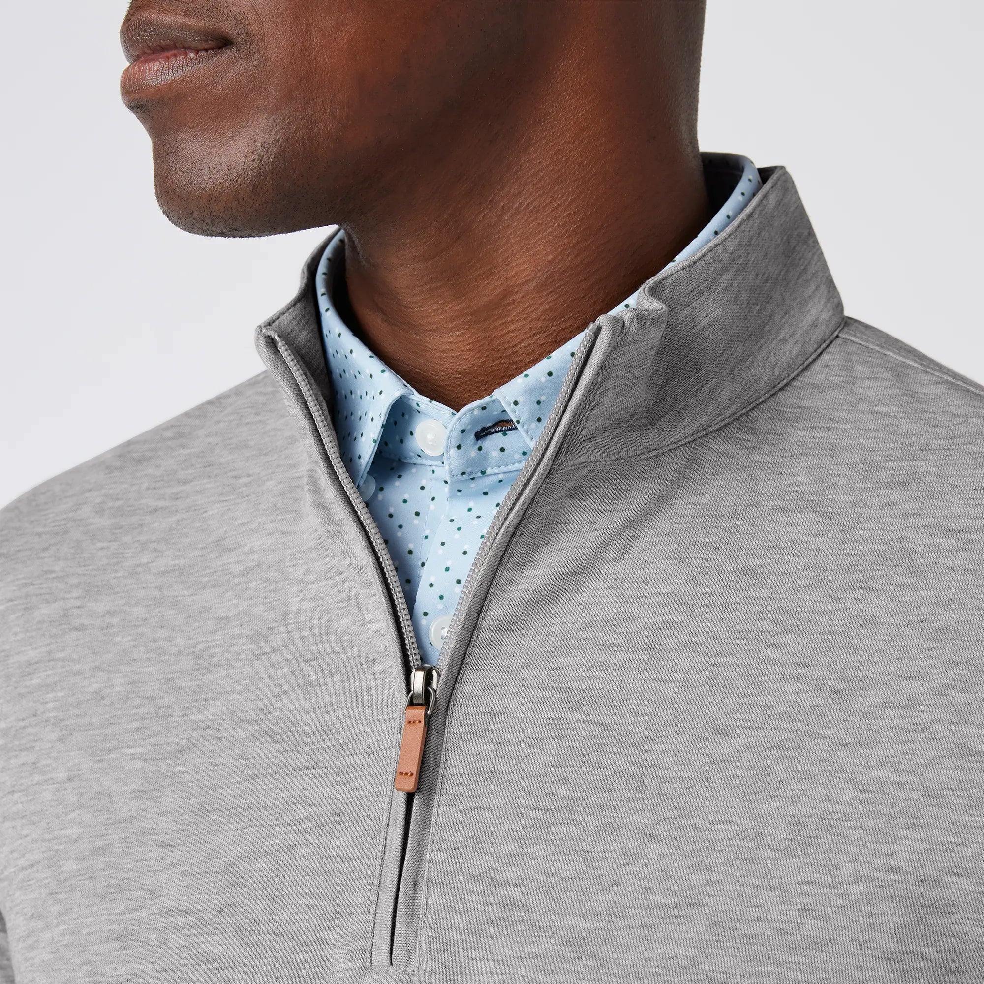 Grey men's golf quarter-zip sweater from the brand Mizzen+Main.