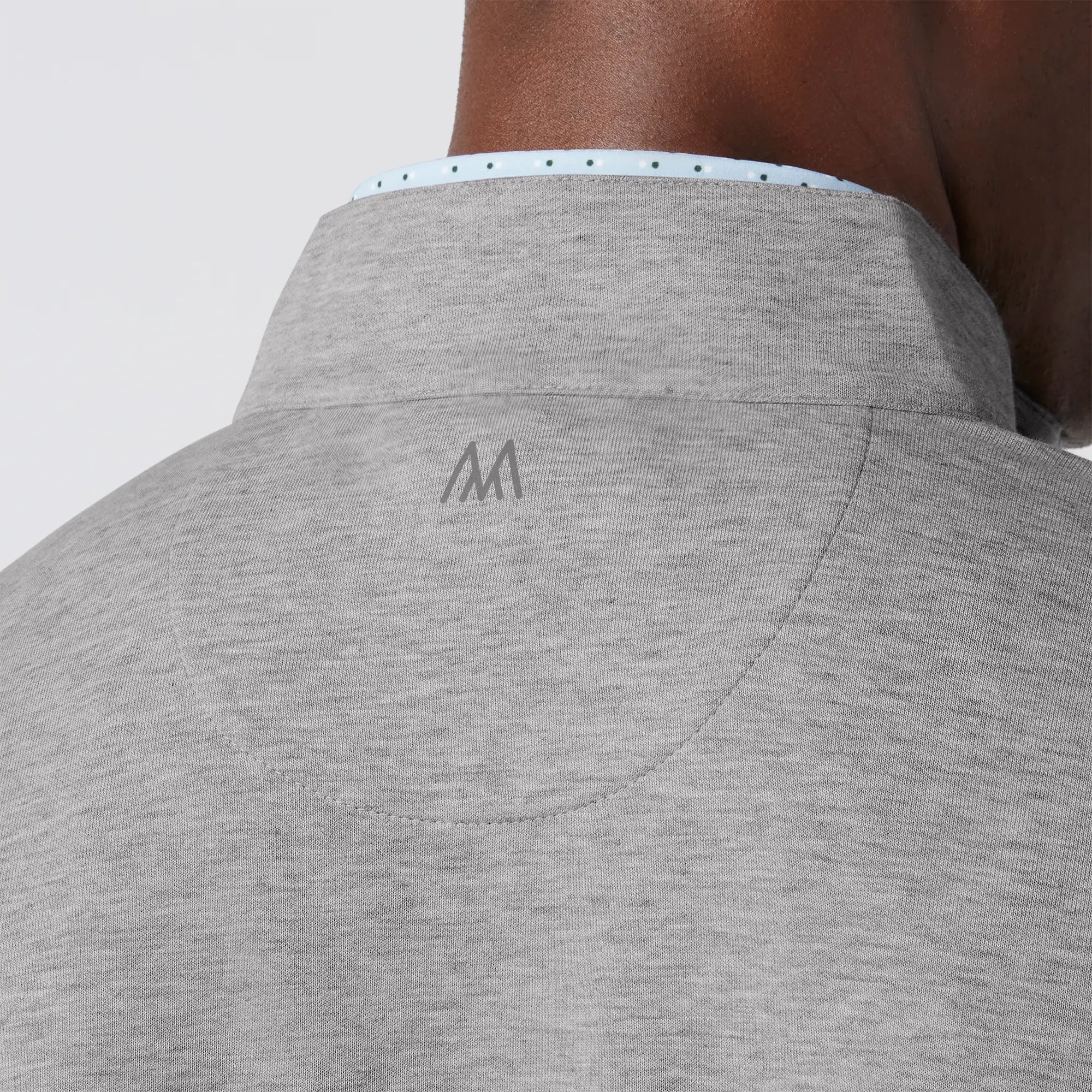 Grey men's golf quarter-zip sweater from the brand Mizzen+Main.