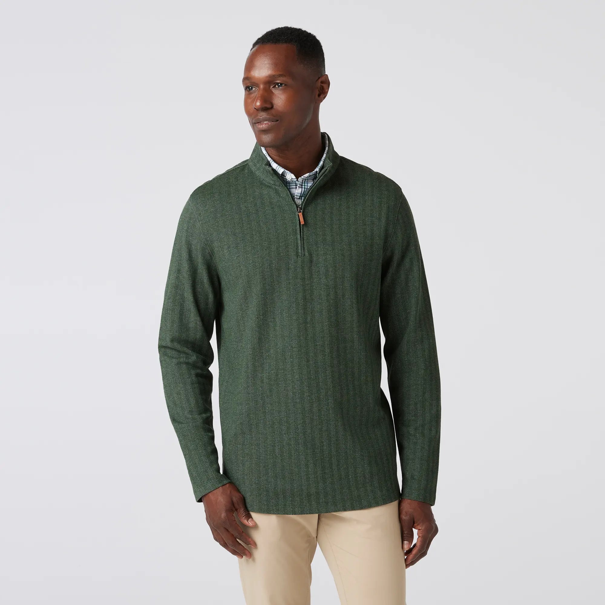 Green men's golf quarter-zip sweater from the brand Mizzen+Main.