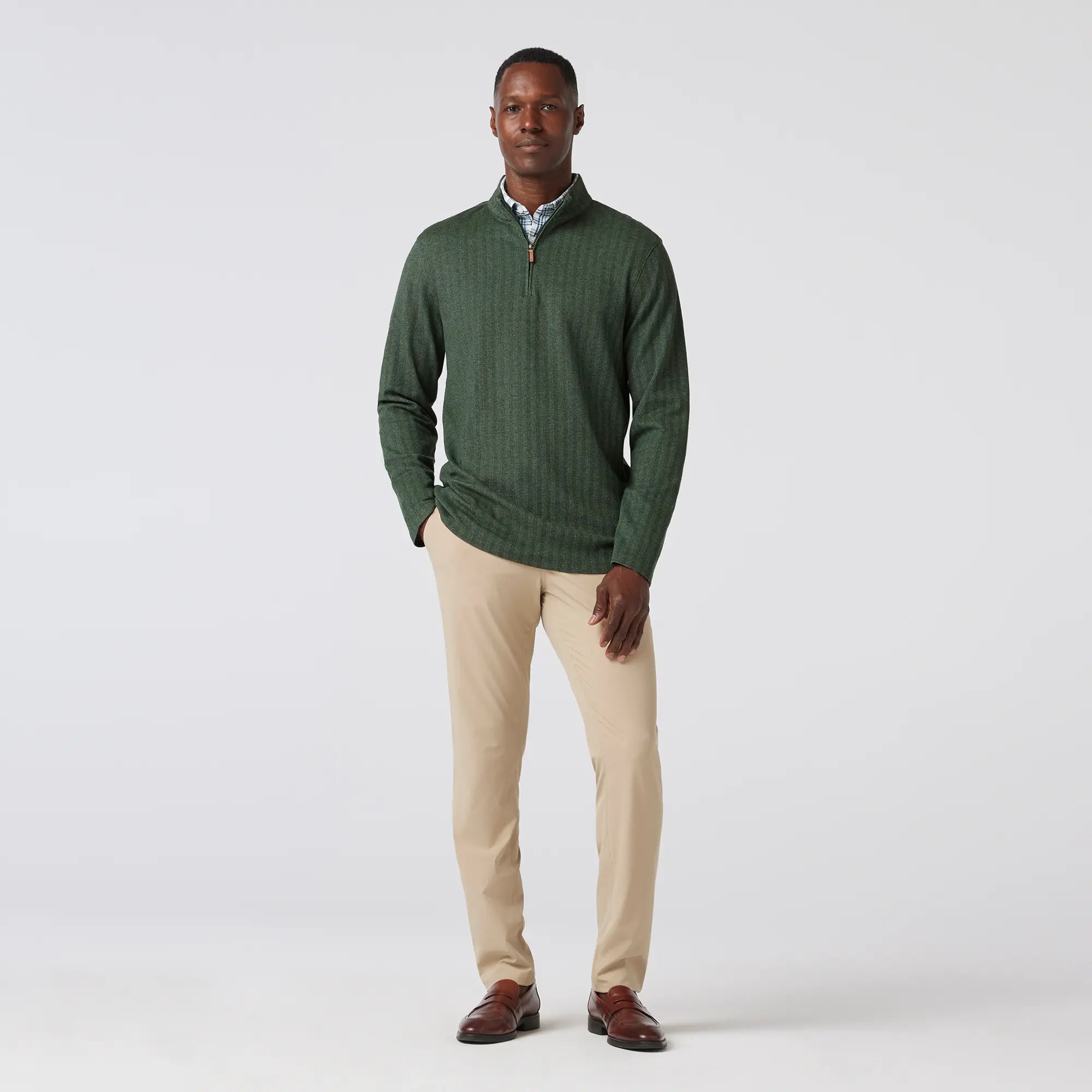 Green men's golf quarter-zip sweater from the brand Mizzen+Main.