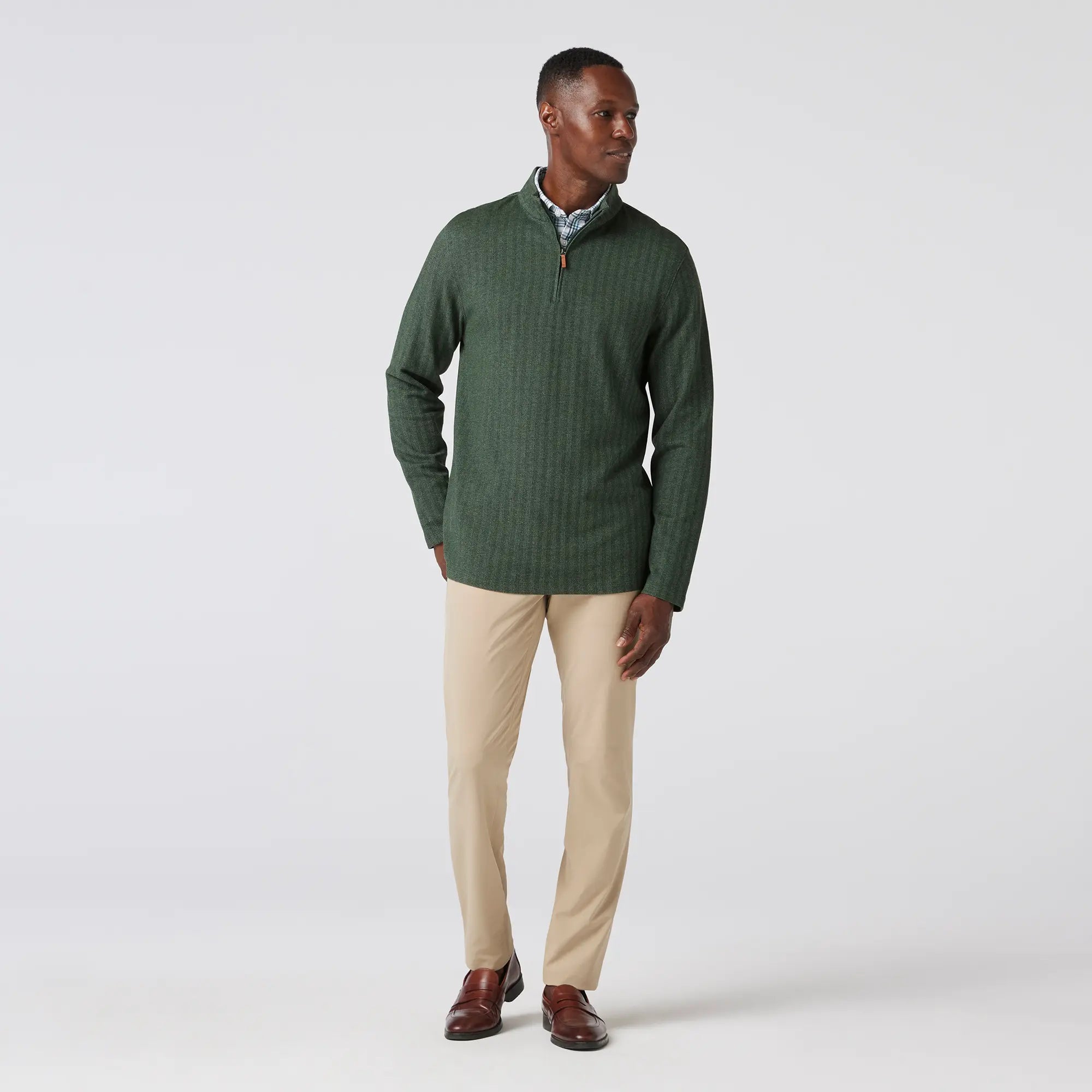 Green men's golf quarter-zip sweater from the brand Mizzen+Main.