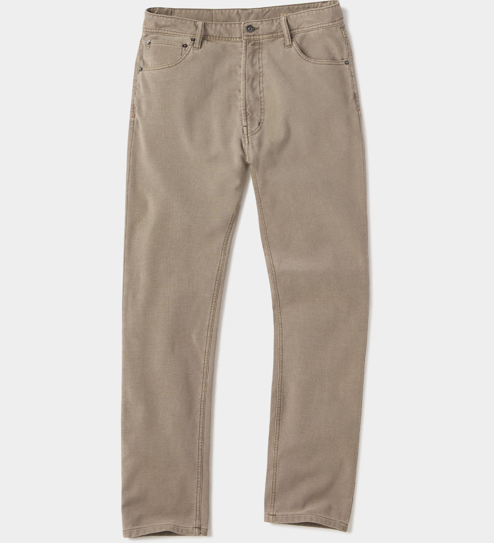 Front view of a pair of Comfort Terry Pant from The Normal Brand in the color taupe. The pants have two side pockets, and a button closure.
