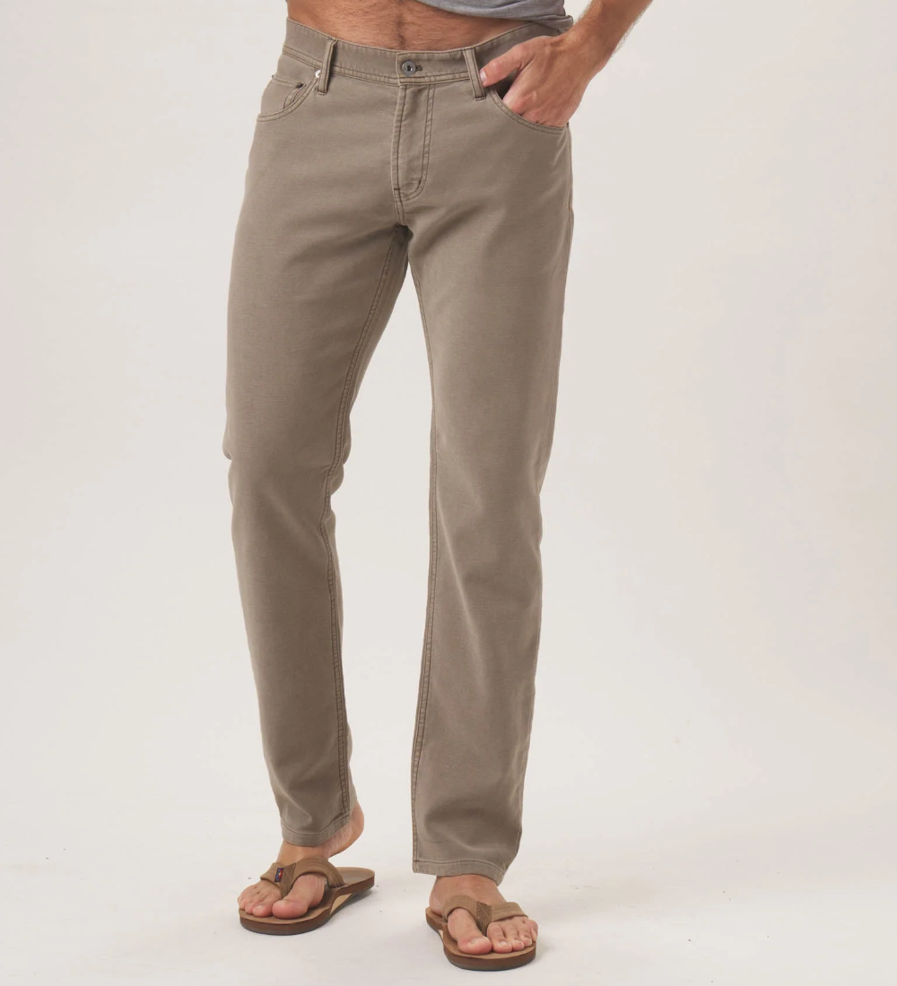 Front view of a pair of Comfort Terry Pant from The Normal Brand in the color taupe. The pants have two side pockets, and a button closure.