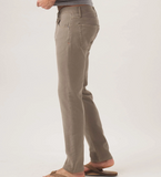 Side view of a pair of Comfort Terry Pant from The Normal Brand in the color taupe. The pants have two side pockets, and a button closure.