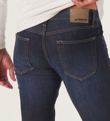 Back view of The Normal Jean from The Normal Brand in dark blue color.