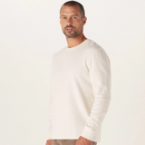 A front view of a white Vintage Thermal Crew sweater from The Normal Brand.