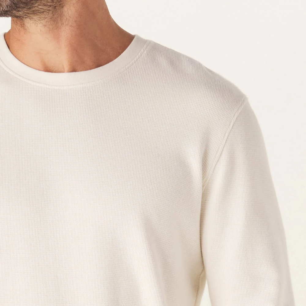 A front view of a white Vintage Thermal Crew sweater from The Normal Brand.