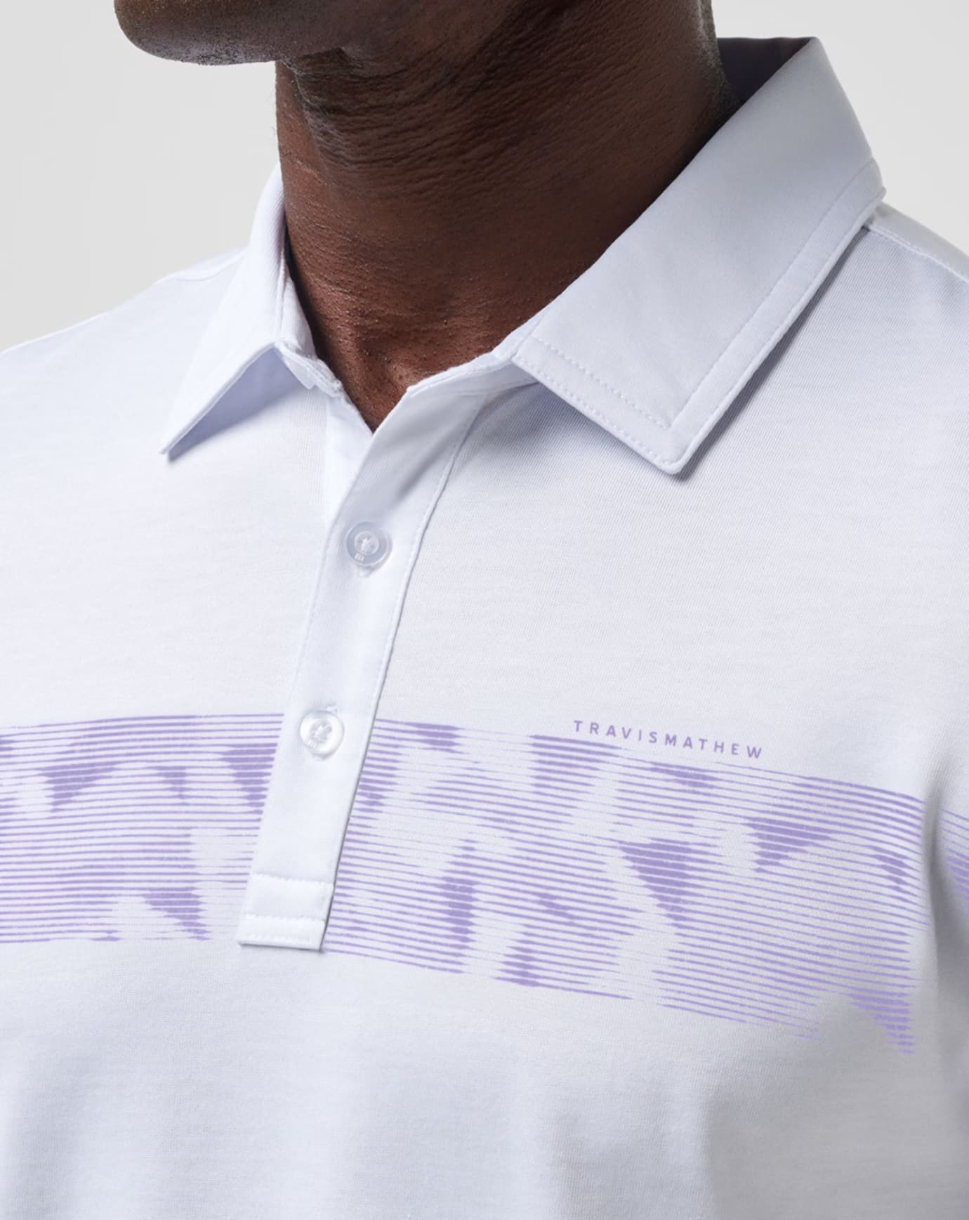 The TravisMathew Bigger Boat golf polo for men, in the color white.