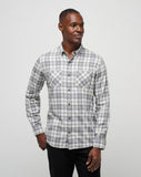 Men's flannel plaid shirt in the color white from the brand TravisMathew.