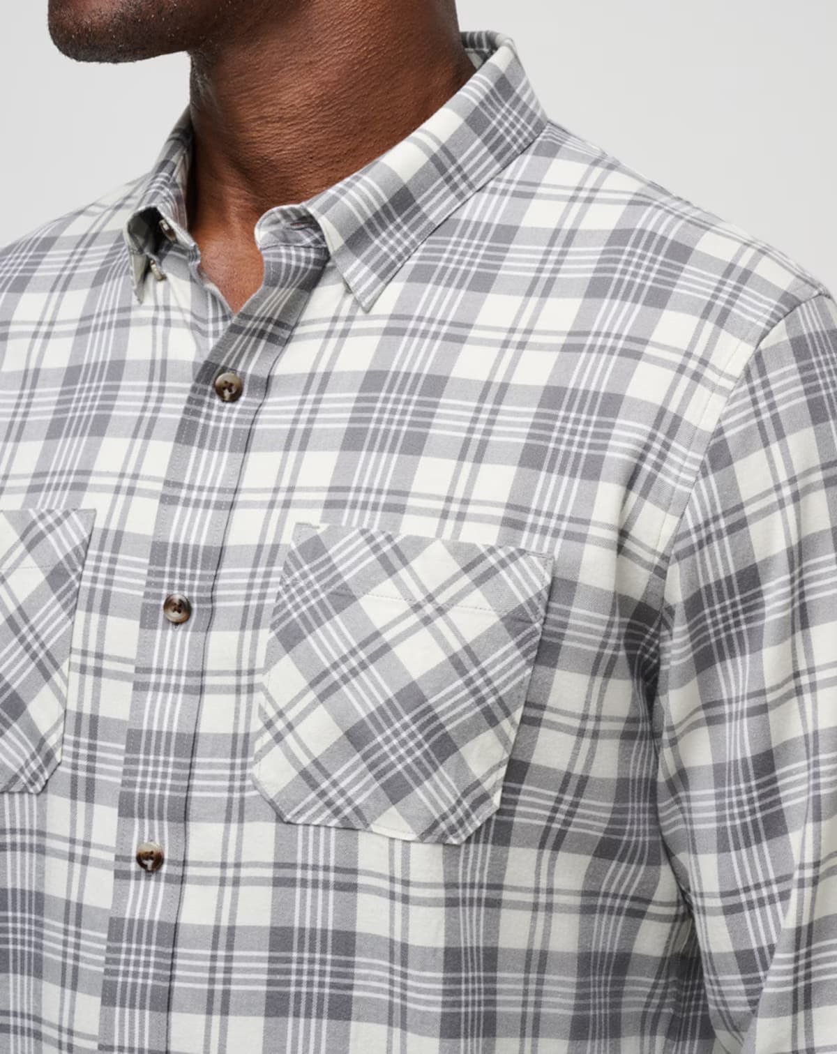 Men's flannel plaid shirt in the color white from the brand TravisMathew.