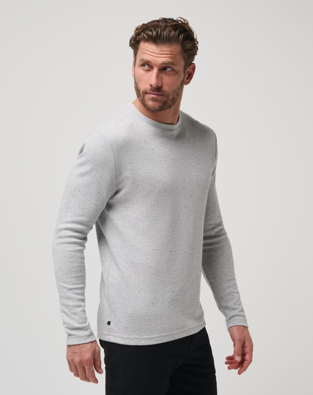 Waffle knit sweater for men from TravisMathew golf brand.