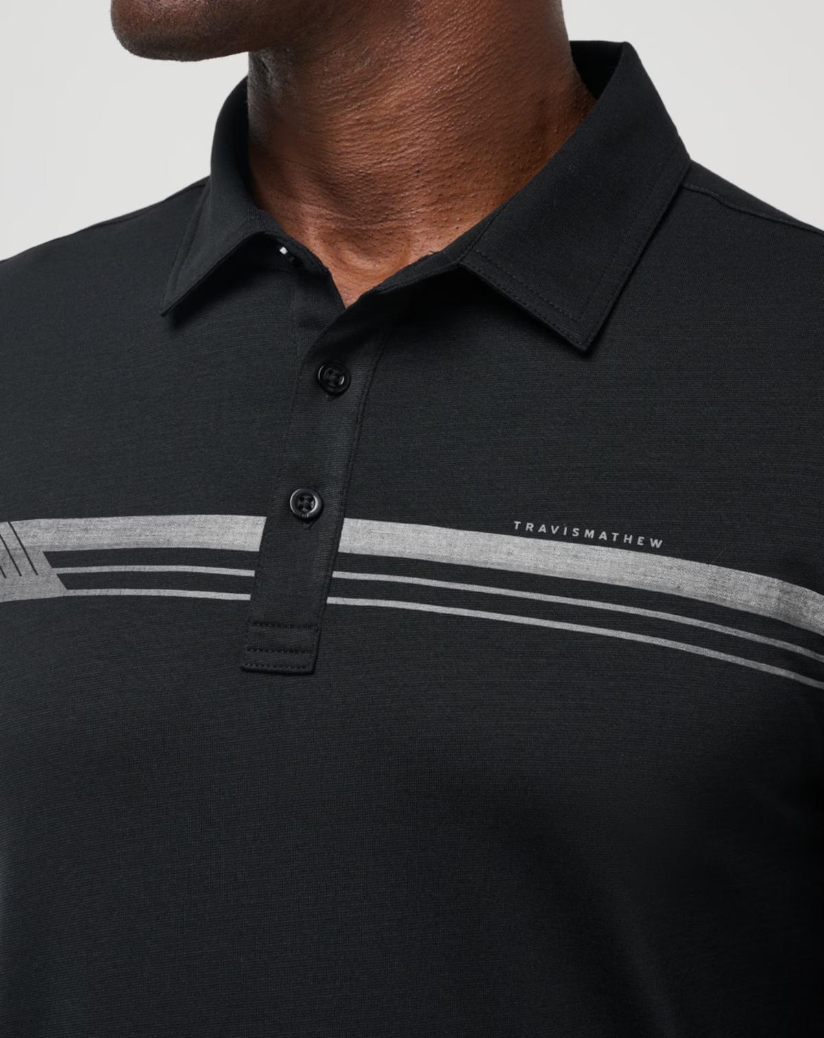 Course Mapper Long Sleeve Polo in all black. Featuring a grey stripe logo across the chest. The polo comes from the brand TravisMathew.