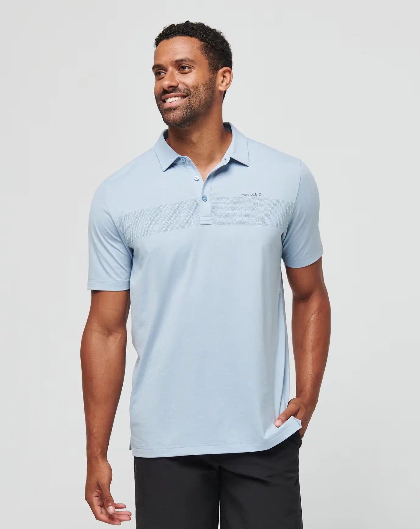 The Travis Mathew Jungle Pyramid Golf Polo in the color blue.