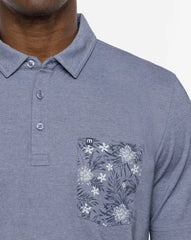 TravisMathew Men's No Maps Polo shirt in heather peacoat blue.