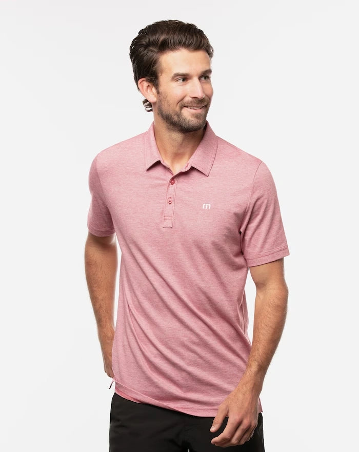 TravisMathew Men's The Zinna Polo in color Heather Cardinal Red.