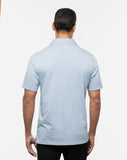 TravisMathew Men's The Zinna Polo in the color heather light blue.