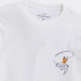 A white t-shirt from Vineyard Vines. Showing a fishermen wearing a yellow wet suit, riding a large mouth bass fish, with a fishing hook in front of it's mouth.