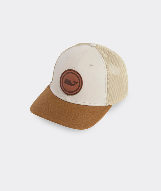 A Vineyard Vines leather trucker hat with a brown Vineyard Vines logo hat. 1680