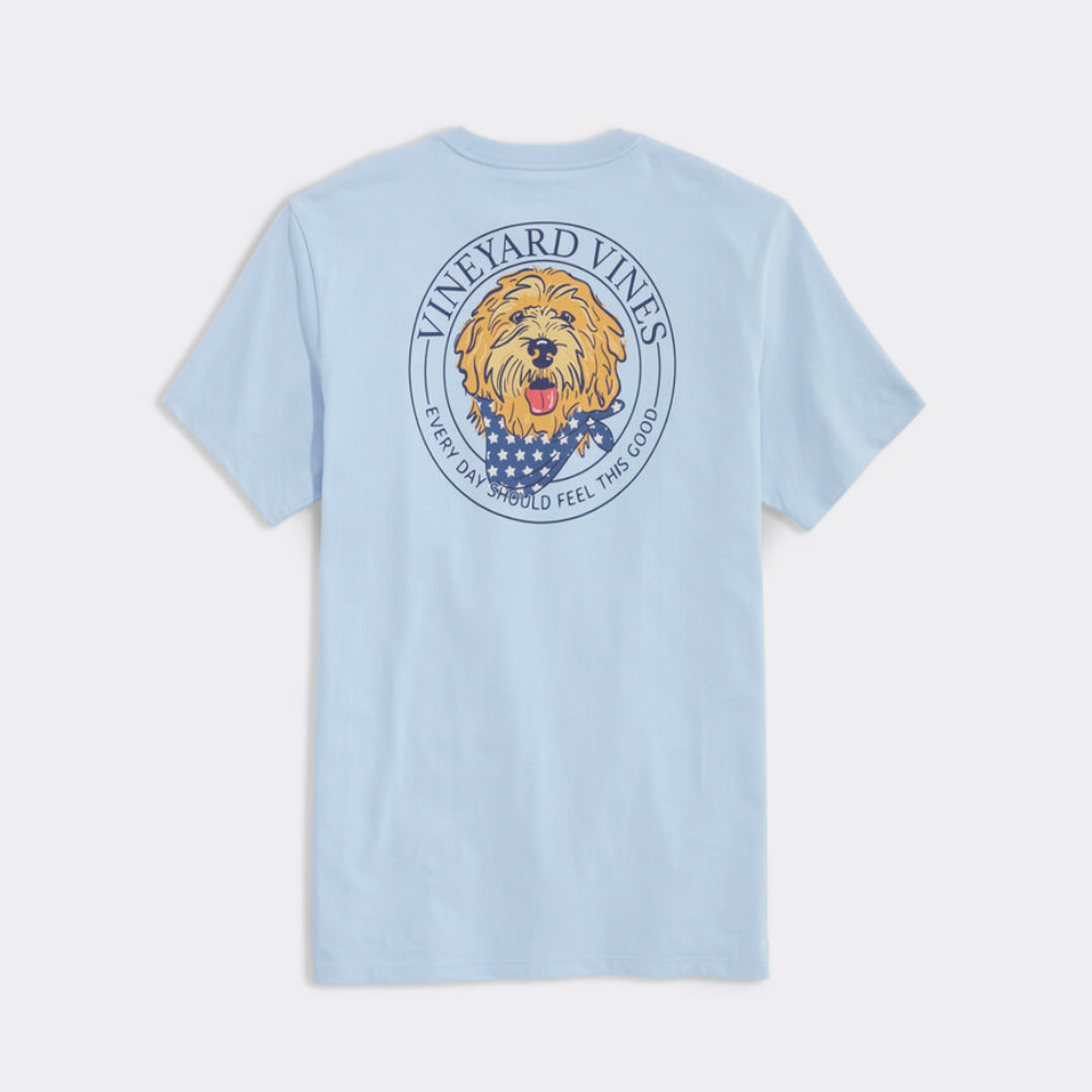 Blue colored t-shirt from Vineyard Vines with a puppy dog logo. The dog is wearing a patriotic bandana.