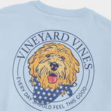 Blue colored t-shirt from Vineyard Vines with a puppy dog logo. The dog is wearing a patriotic bandana.