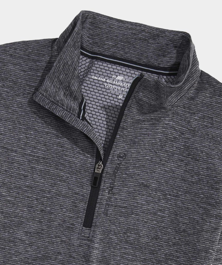 Men's performance golf style pullover q-zip from Vineyard Vines. This pullover is the color evening sky.