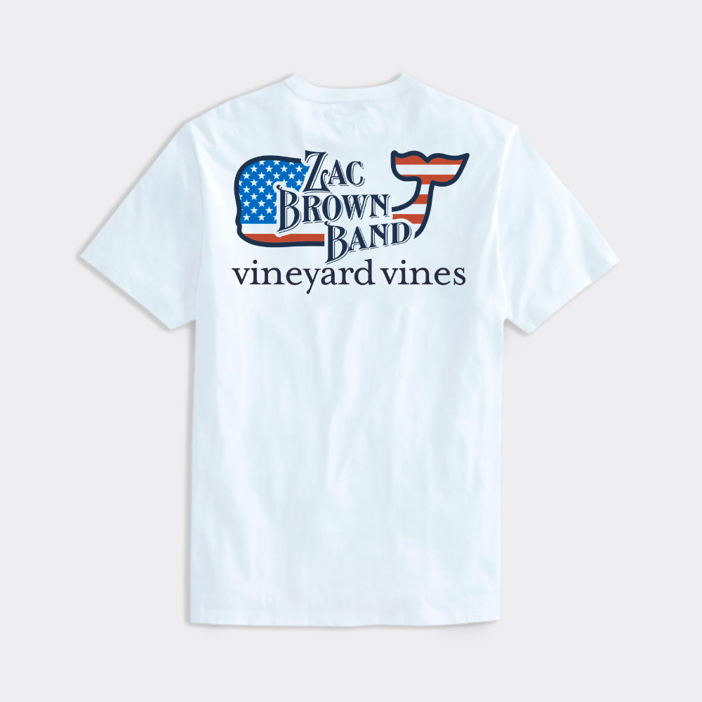 Limited edition Vineyard Vines t-shirt in the color white, with an American Flag Vineyard Vines logo whale on the back with The Zac Brown Band logo over top of the whale. The Vineyard Vines name is shown just below the whale.