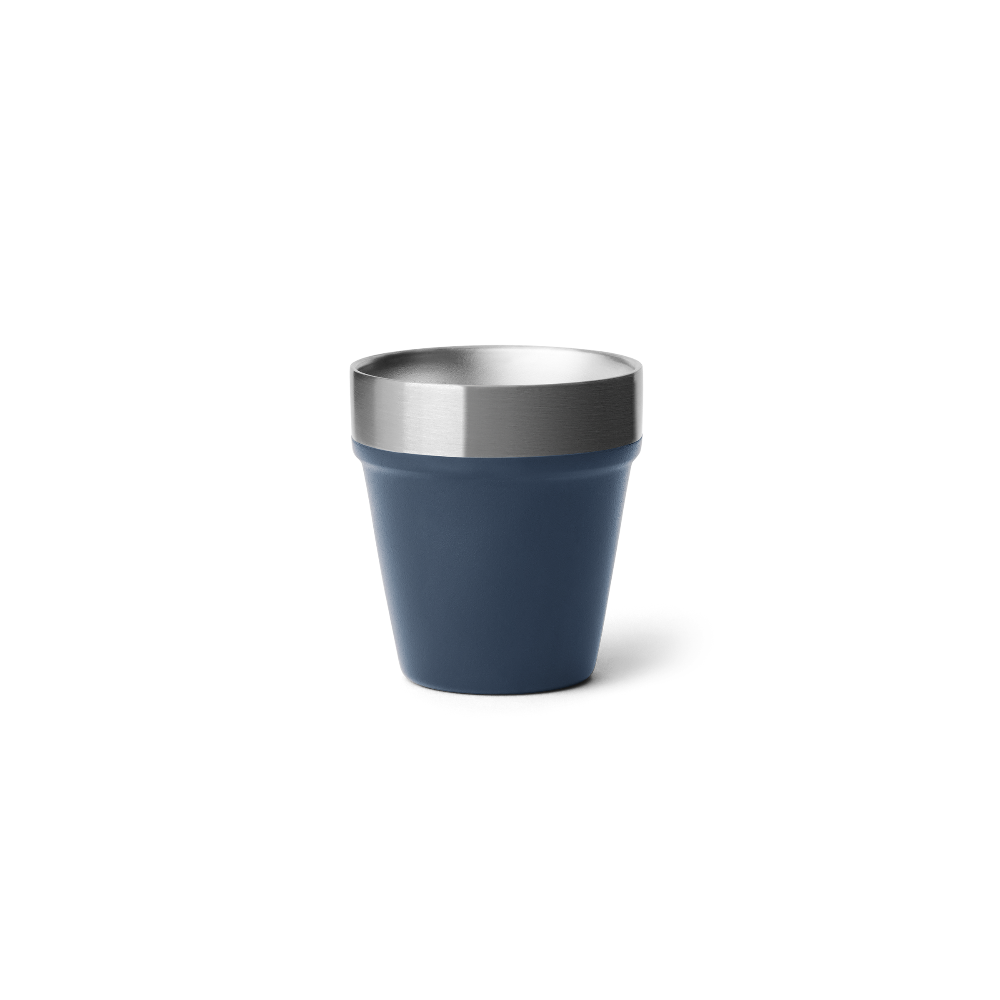 A navy blue shot glass with a stainless steel rim on the top.