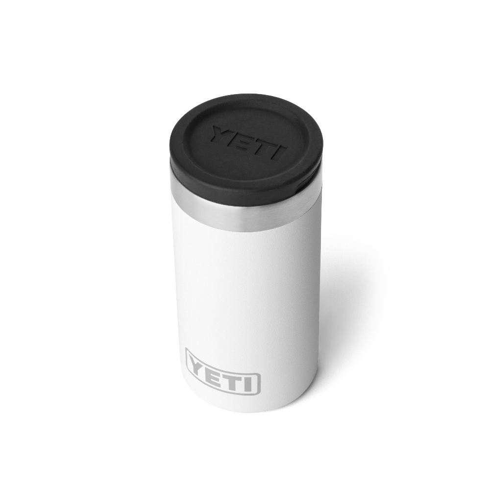 The top view of a white shot glass travel case, showing a black lid with a black YETI logo engraved into the lid. Also a silver YETI logo on the front of the case.