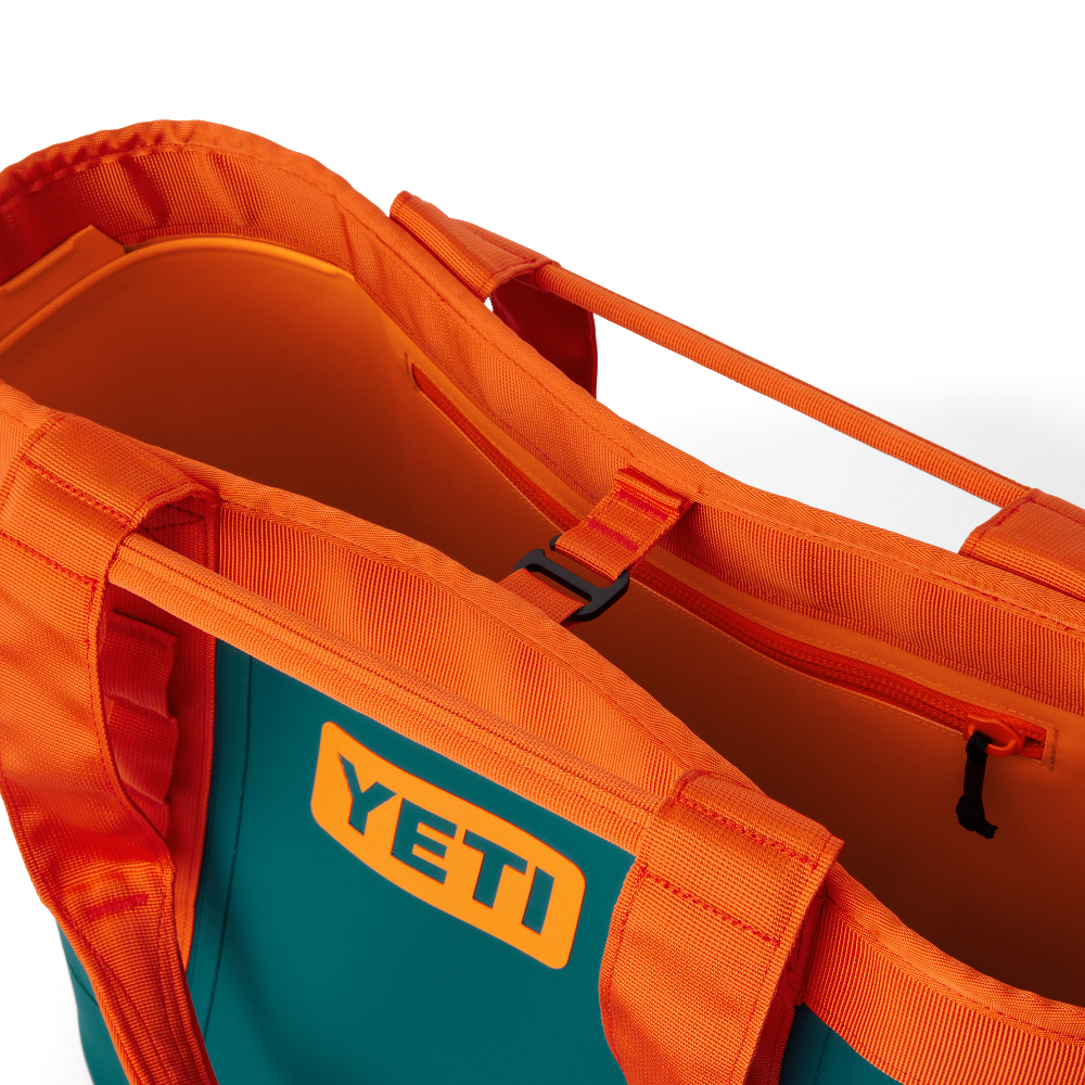 YETI Camino Carryall 35 2.0 Tote Bag in the color orange and teal, from YETI Crossover collection.