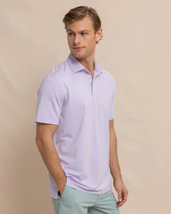 The front view of the Southern Tide brrr eeze Heather Performance Polo Shirt by Southern Tide - Heather Orchid Peta