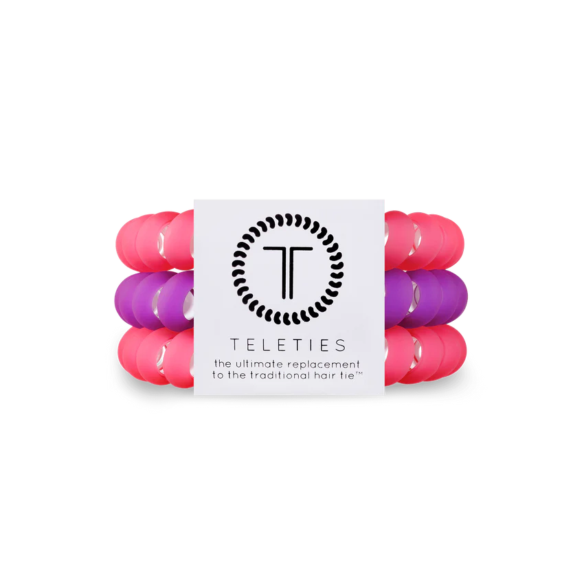 A pack of 3 large hair ties. Two pink, one purple. From TELETIES.