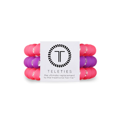 A pack of 3 large hair ties. Two pink, one purple. From TELETIES.