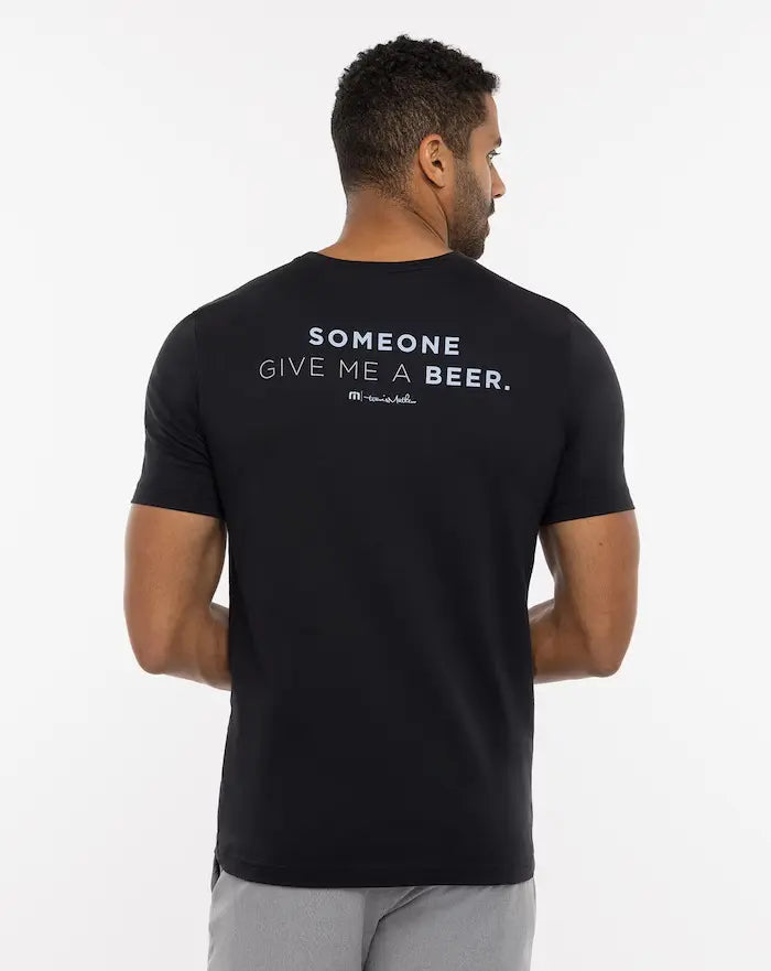 Travis Mathew Finest Bottle Tee with the phrase, "Someone give me a beer" on the back.