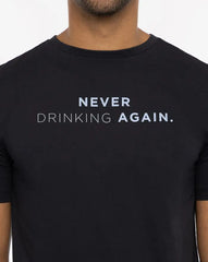 Travis Mathew Finest Bottle Tee with the phrase "Never drinking again" on the chest. Shirt in the color black, text in the color blue.