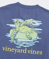 Close up of the graphic on the back of the Men's Lazy River Turtle Short Sleeve Pocket Tee. A turtle wearing sunglasses, while floating down the lazy river.