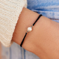 Pura Vida Simple Pearl Bead Silver Bracelet, being worn by a model.