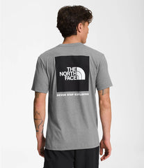 North Face Men's Short Sleeve Box NSE Tee In Grey, showing the back logo graphic that reads "The North Face, never stop exploring."